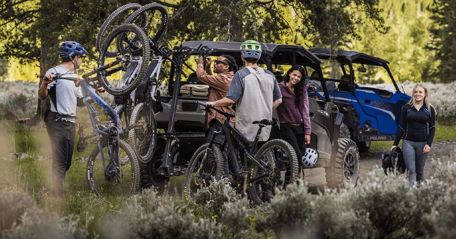 People on Polaris Off Road Vehicles